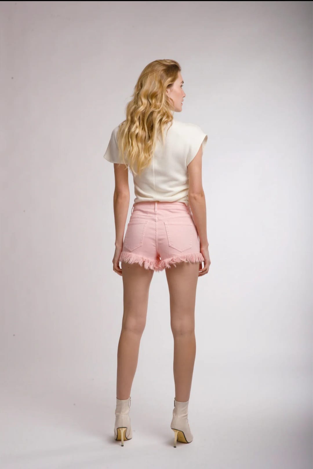 Shorts con frange